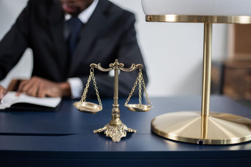 Balance scales representing the LLC versus S-Corp tax and liability trade-off