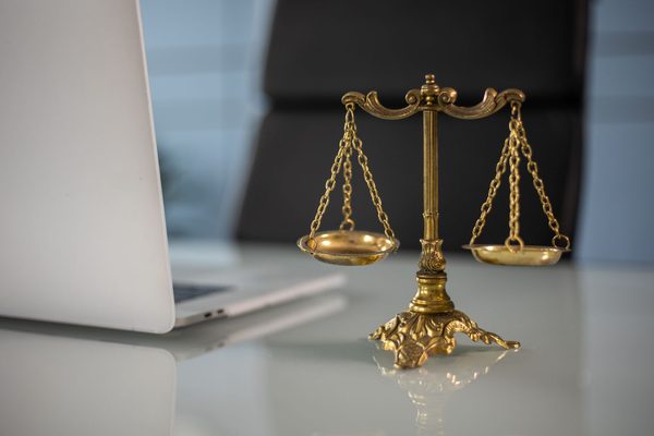 Courtroom gavel and law books representing criminal defense costs