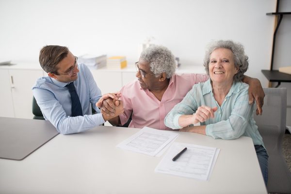 Family reviewing life insurance policy options together at home