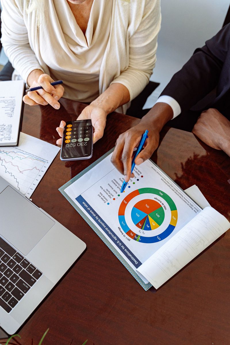 Business owners discussing revolving credit terms with a lender