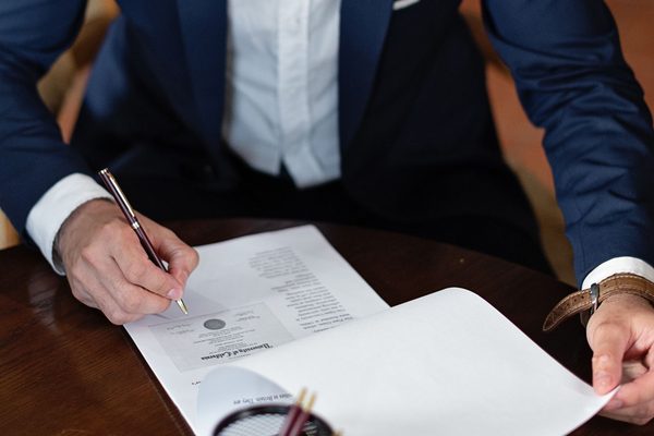 Attorney reviewing a personal injury claim file with a client